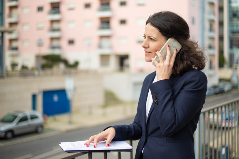 businesswoman on the phone in a balcony 